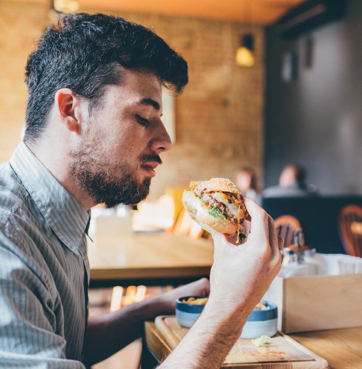 A man holding a hamburger